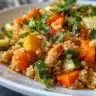 Healthy quinoa bowl topped with roasted vegetables, showcasing vibrant colors and textures.