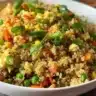 Delicious quinoa fried rice with vegetables in a bowl