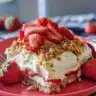 A delightful dessert featuring fresh strawberries and cream in a beautiful presentation.