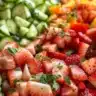 Delicious Strawberry Gazpacho served in a bowl garnished with fresh strawberries.