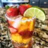 Delicious Strawberry Mango Margarita in a glass with fresh fruit garnish