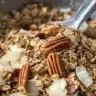 Bowl of ultimate homemade granola with nuts, fruits, and seeds