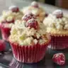Delicious freshly baked White Chocolate Raspberry Muffins on a cooling rack.