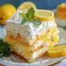Delicious zesty lemon trifle dessert with layers of lemon and sponge cake