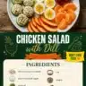 Chilled chicken salad with fresh dill, served in a bowl with colorful vegetables.
