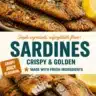 Golden crispy fried sardines served on a plate with lemon and herbs.