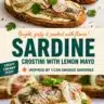 Delicious smoked sardine crostini with lemon mayo served on a rustic wooden board.