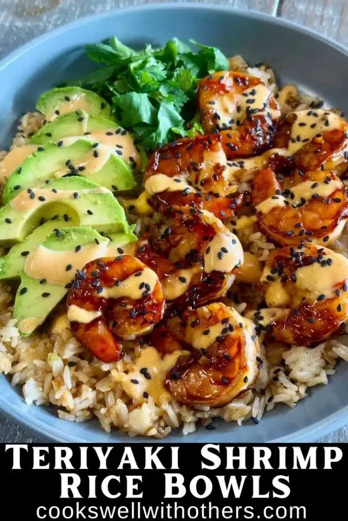 Teriyaki-glazed shrimp rice bowls with fresh vegetables and sesame seeds