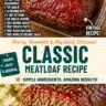 Delicious slice of ultimate meatloaf recipe on a wooden cutting board
