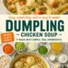 Bowl of chicken soup with dumplings, topped with fresh herbs and served hot.
