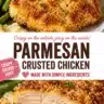 Crispy Parmesan Chicken served on a plate with herbs and lemon wedges
