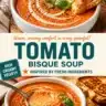 Bowl of creamy tomato bisque garnished with fresh herbs and croutons