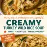 Creamy turkey wild rice soup in a bowl garnished with herbs